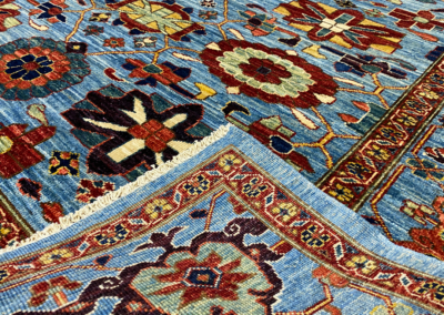 Aryana light blue and red rug front and back