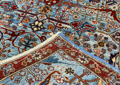 Nooristan blue and red rug front and back