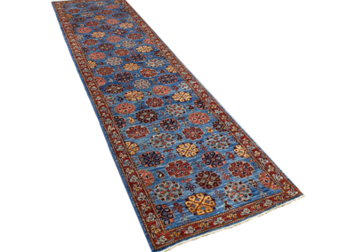 Fine Aryana red and blue runner rug angle