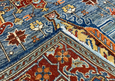 Aryana rug blue base red tone border front and back