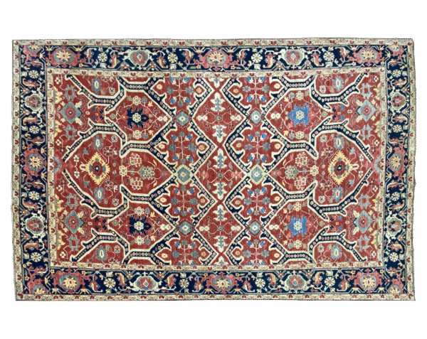 This bold tribal area rug is 9x12 featuring large tribal geometric shapes with bold red, blue and multicolored tones. This rug is hand knotted with wool.