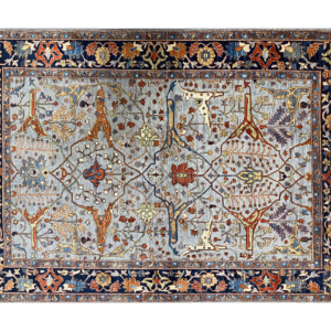 A bold and stunning Aryana 6x9 area rug. This rug features a light blue background with multicolored tribal designs throughout.