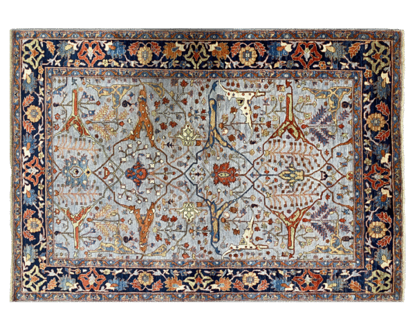 A bold and stunning Aryana 6x9 area rug. This rug features a light blue background with multicolored tribal designs throughout.