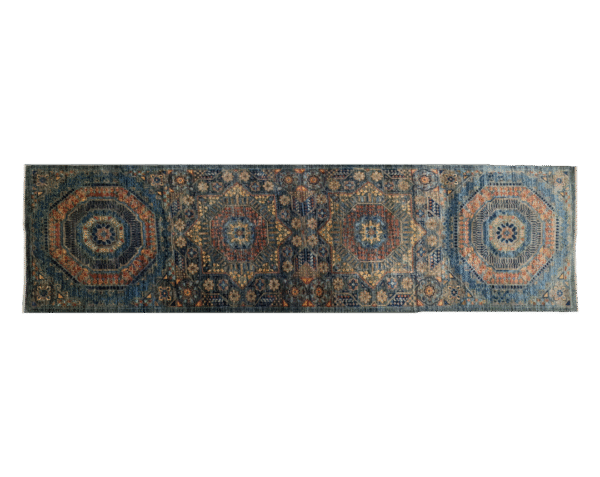 3x10 area rug with a green background and large multicolored geometric shapes.