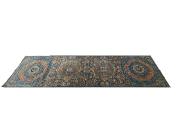 3x10 area rug with a green background and large multicolored geometric shapes.