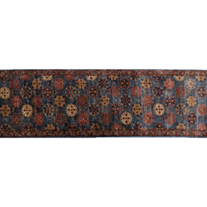 Long 3x10 area rug runner with deep blues, orange, and yellows. This rug features a geometric pattern with a border and short fringe.
