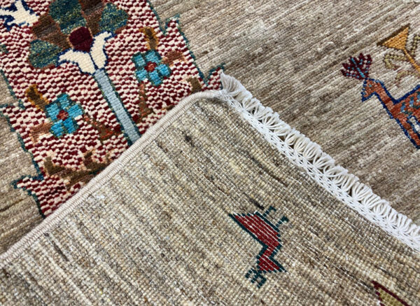 6x9 area rug featuring beautiful trees in blue, red, pink and yellow tones.