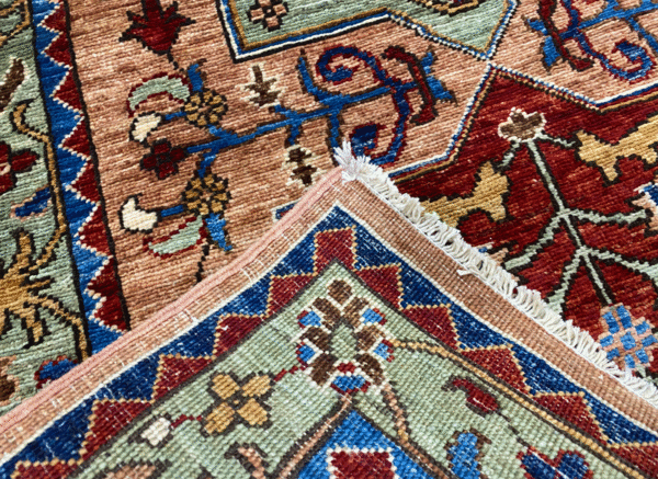 Stunning long 3x10 area rug runner with a gold background. This rug features large geometric shapes with blue and red tones and a border and short fringe.