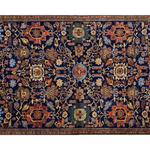 Stunning 6x9 rug with deep blues, orange, and yellows. This rug features a geometric pattern with a border and short fringe.