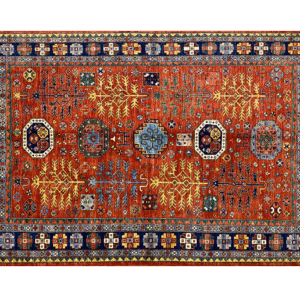 Bold large rug with deep red/rust tones and a blue border. This area rug is hand-knotted with wool.
