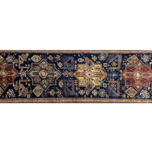 Stunning long 3x10 area rug runner with a deep blue background, yellow, and red. This rug features a geometric pattern with a border and short fringe.