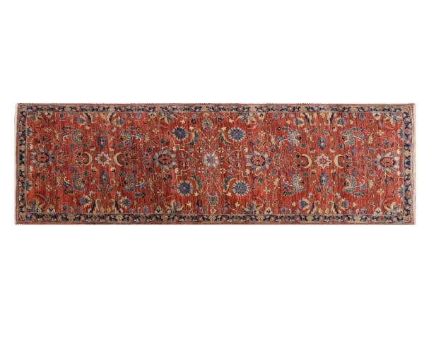 Bold large rug with deep rust tones and a blue border with yellow designs. This area rug is hand-knotted with wool.