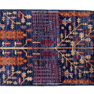 Small bold fun small rug with deep blue, orange and yellow tones. This area rug is hand-knotted with wool.