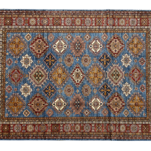 Large 9x12 tribal area rug with a blue background and ivory and rust tribal designs with a large border. This area rug is hand-knotted with wool.