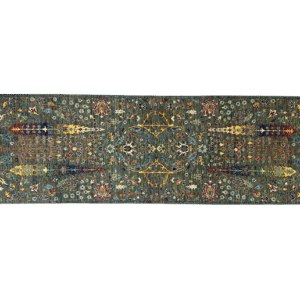 Nooristan 3x8 area rug with a green background and tribal yellow tree designs. This rug is hand-knotted with wool.