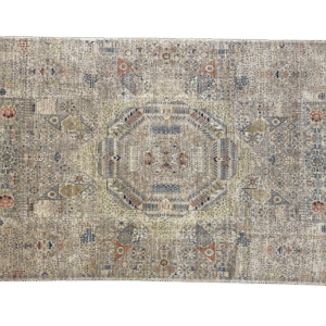 Large stunning rug with beautiful nuetral tones in a Mamluk style. This rug features a center medallion, borders, and fringe.