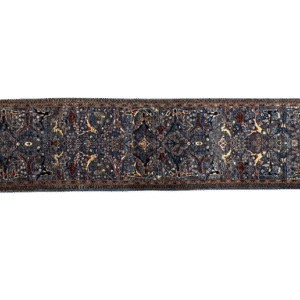 Nooristan 3x12 area rug with a blue background and tribal yellow and red designs. This rug is hand-knotted with wool.