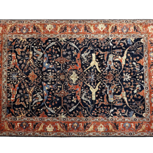 Large 9x12 tribal area rug with a navy background and multicolored tribal designs with a large border. This area rug is hand-knotted with wool.