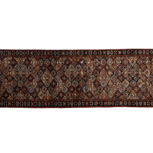Long Faryab 3x10 area rug with a red, blue, Ivory, and yellow checkard background. This rug is hand-knotted with wool.