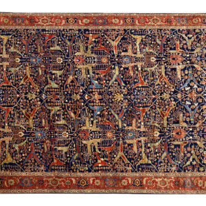 Large 9x12 tribal area rug with a navy background and multicolored tribal designs with a large border. This area rug is hand-knotted with wool.
