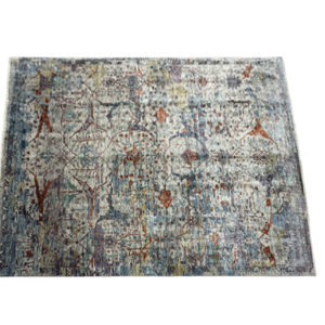 Large 8x10 tribal area rug with a blue background and multicolored tribal designs. This area rug is hand-knotted with wool.