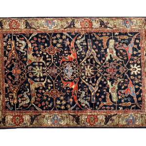 Tribal 4 x 6 area rug with navy background and green border. Bold in color and style.