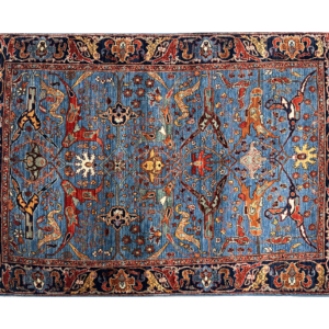 Tribal 4 x 6 area rug with bright blue and multicolored tones in tribal designs.