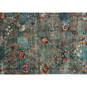 Small 3 x 5 area rug with a green background and multicolored tribal designs.