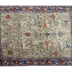 Large 8 x 10 Tribal Aryana area rug with a green background and blue and rust border with short fringe.