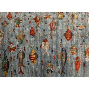 Large area rug featuring the ocean with colorful fish. This rug is hand-knotted with wool.