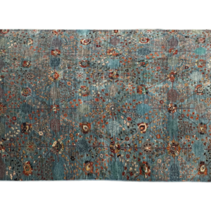 Stunning 6 x 9 area rug with a bright blue background and multicolored tribal designs. This area rug is hand-knotted with wool.