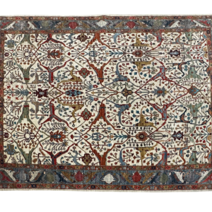 Large 9 x 12 Tribal Faryab area rug with a blue background and blue and rust border with short fringe.