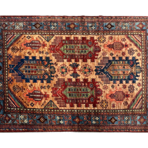 Stunning 5 x 7 area rug with a orange background and multicolored tribal designs. This area rug is hand-knotted with wool.