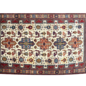 Tribal area rug with ivory and red tones. This rug is hand-knotted with wool.