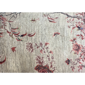 Stunning 8 x 10 area rug with trees and bird designs. This rug is hand-knotted with wool.