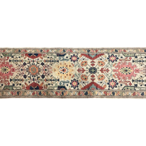 Stunning long 3' x 10' area rug runner. This area rug is hand-knotted with wool featuring tribal bright designs.