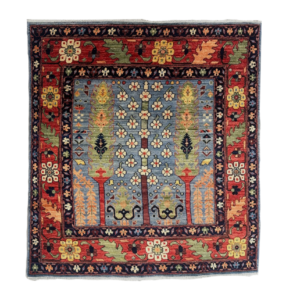 Small 4 x 4 square area rug featuring trees and a border. Hand-knotted with wool.