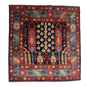 Small 4 x 4 square area rug featuring trees and a border. Hand-knotted with wool.