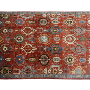 Bold 6 x 9 area rug with geometric designs throughout. This rug is hand-knotted with wool.