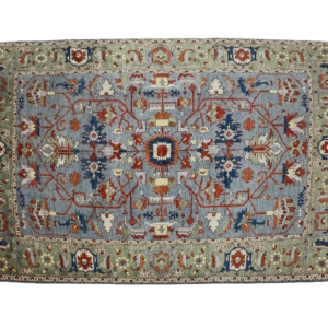 Large 10x14 area rug with blue and green. This rug is hand-knotted with wool.