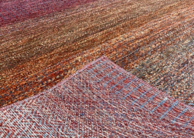 Malibu Zuma red and orange sunset rug front and back
