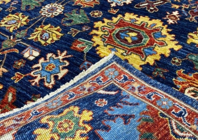 Makmal tribal geometric wool rug navy front and back