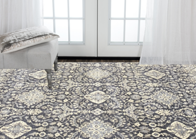 Night patterned area rug in blue and brown