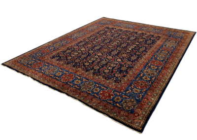Nooristan tribal rug navy and multicolor angle