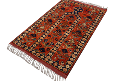 Ensari rust and fringe tribal rug angle